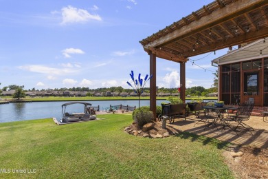 Beautiful waterfront home in the gated community of the Shores on Lake Caroline Golf Club in Mississippi - for sale on GolfHomes.com, golf home, golf lot