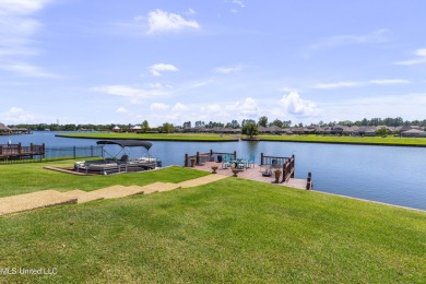 Beautiful waterfront home in the gated community of the Shores on Lake Caroline Golf Club in Mississippi - for sale on GolfHomes.com, golf home, golf lot