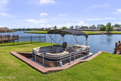 Beautiful waterfront home in the gated community of the Shores on Lake Caroline Golf Club in Mississippi - for sale on GolfHomes.com, golf home, golf lot