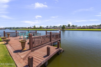 Beautiful waterfront home in the gated community of the Shores on Lake Caroline Golf Club in Mississippi - for sale on GolfHomes.com, golf home, golf lot