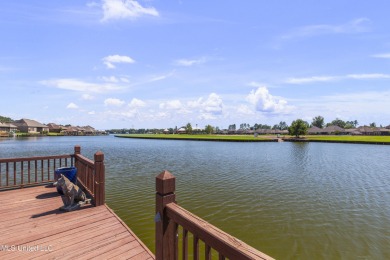 Beautiful waterfront home in the gated community of the Shores on Lake Caroline Golf Club in Mississippi - for sale on GolfHomes.com, golf home, golf lot