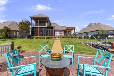 Beautiful waterfront home in the gated community of the Shores on Lake Caroline Golf Club in Mississippi - for sale on GolfHomes.com, golf home, golf lot