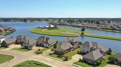 Beautiful waterfront home in the gated community of the Shores on Lake Caroline Golf Club in Mississippi - for sale on GolfHomes.com, golf home, golf lot