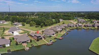 Beautiful waterfront home in the gated community of the Shores on Lake Caroline Golf Club in Mississippi - for sale on GolfHomes.com, golf home, golf lot