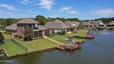 Beautiful waterfront home in the gated community of the Shores on Lake Caroline Golf Club in Mississippi - for sale on GolfHomes.com, golf home, golf lot