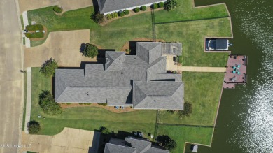 Beautiful waterfront home in the gated community of the Shores on Lake Caroline Golf Club in Mississippi - for sale on GolfHomes.com, golf home, golf lot