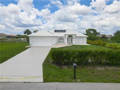 Waterfront Pool Home with Solar in exclusive Cape Coral! Welcome on El Rio Golf Course and Club in Florida - for sale on GolfHomes.com, golf home, golf lot