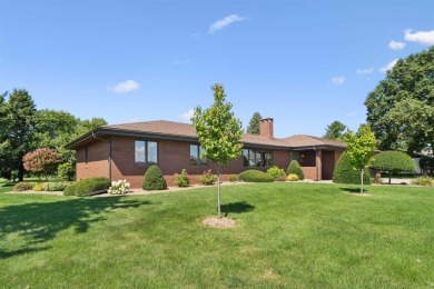 Step into timeless elegance with this beautifully crafted home on Waukon Golf and Country Club in Iowa - for sale on GolfHomes.com, golf home, golf lot