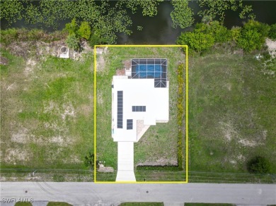 Waterfront Pool Home with Solar in exclusive Cape Coral! Welcome on El Rio Golf Course and Club in Florida - for sale on GolfHomes.com, golf home, golf lot