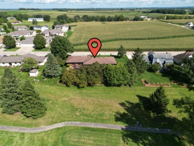 Step into timeless elegance with this beautifully crafted home on Waukon Golf and Country Club in Iowa - for sale on GolfHomes.com, golf home, golf lot