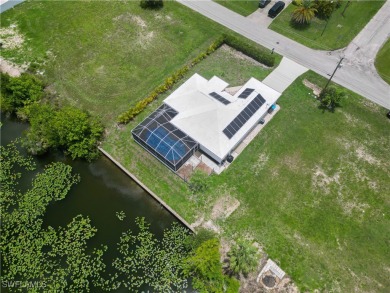 Waterfront Pool Home with Solar in exclusive Cape Coral! Welcome on El Rio Golf Course and Club in Florida - for sale on GolfHomes.com, golf home, golf lot
