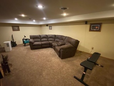 Take a look at this attractive ranch style home located adjacent on Split Rock Country Club in South Dakota - for sale on GolfHomes.com, golf home, golf lot