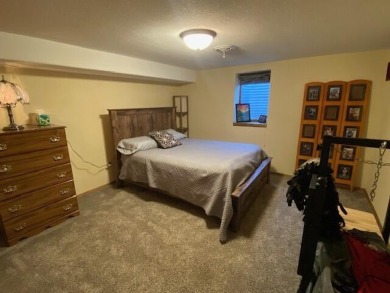 Take a look at this attractive ranch style home located adjacent on Split Rock Country Club in South Dakota - for sale on GolfHomes.com, golf home, golf lot