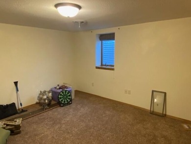 Take a look at this attractive ranch style home located adjacent on Split Rock Country Club in South Dakota - for sale on GolfHomes.com, golf home, golf lot