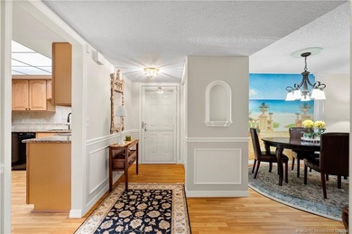 This spectacular furnished turnkey first-floor 2BR/2BA residence on Miles Grant Country Club in Florida - for sale on GolfHomes.com, golf home, golf lot