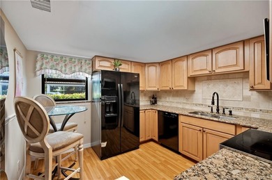 This spectacular furnished turnkey first-floor 2BR/2BA residence on Miles Grant Country Club in Florida - for sale on GolfHomes.com, golf home, golf lot