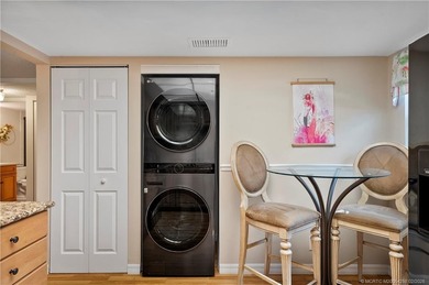 This spectacular furnished turnkey first-floor 2BR/2BA residence on Miles Grant Country Club in Florida - for sale on GolfHomes.com, golf home, golf lot