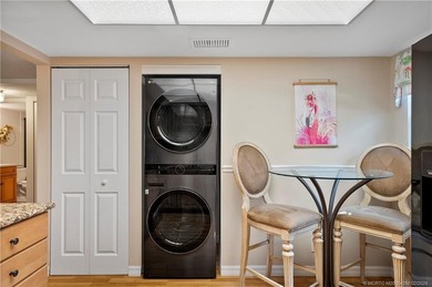 This spectacular furnished turnkey first-floor 2BR/2BA residence on Miles Grant Country Club in Florida - for sale on GolfHomes.com, golf home, golf lot