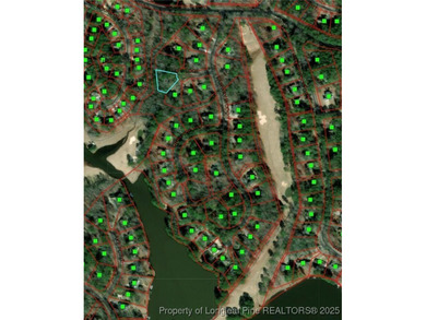 Build your dream home on this beautiful .47-acre wooded lot on Carolina Trace Country Club in North Carolina - for sale on GolfHomes.com, golf home, golf lot