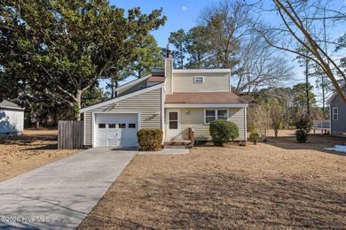 What a deal! Welcome to this 3-bedroom, 2-bath contemporary on Harbour Point Golf Club in North Carolina - for sale on GolfHomes.com, golf home, golf lot