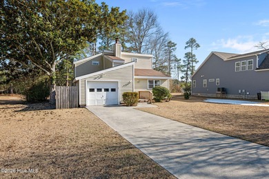 What a deal! Welcome to this 3-bedroom, 2-bath contemporary on Harbour Point Golf Club in North Carolina - for sale on GolfHomes.com, golf home, golf lot