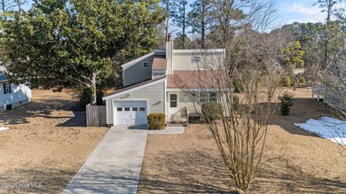 What a deal! Welcome to this 3-bedroom, 2-bath contemporary on Harbour Point Golf Club in North Carolina - for sale on GolfHomes.com, golf home, golf lot