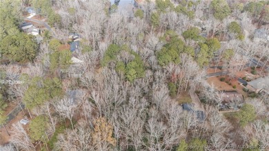 Build your dream home on this beautiful .47-acre wooded lot on Carolina Trace Country Club in North Carolina - for sale on GolfHomes.com, golf home, golf lot