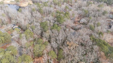 Build your dream home on this beautiful .47-acre wooded lot on Carolina Trace Country Club in North Carolina - for sale on GolfHomes.com, golf home, golf lot
