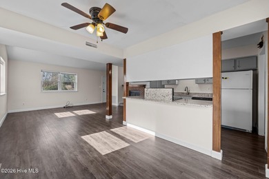 What a deal! Welcome to this 3-bedroom, 2-bath contemporary on Harbour Point Golf Club in North Carolina - for sale on GolfHomes.com, golf home, golf lot