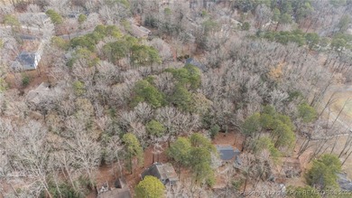 Build your dream home on this beautiful .47-acre wooded lot on Carolina Trace Country Club in North Carolina - for sale on GolfHomes.com, golf home, golf lot