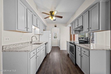 What a deal! Welcome to this 3-bedroom, 2-bath contemporary on Harbour Point Golf Club in North Carolina - for sale on GolfHomes.com, golf home, golf lot