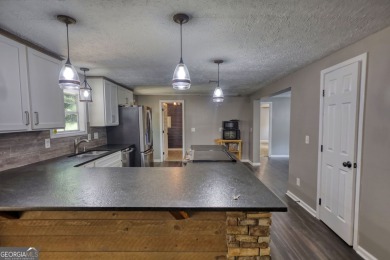 Charming 3-bedroom, 2-bath home in the desirable Turtle Cove on Turtle Cove Golf Course in Georgia - for sale on GolfHomes.com, golf home, golf lot