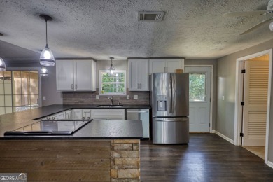 Charming 3-bedroom, 2-bath home in the desirable Turtle Cove on Turtle Cove Golf Course in Georgia - for sale on GolfHomes.com, golf home, golf lot