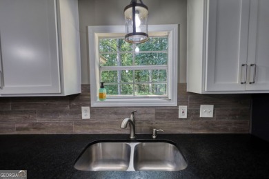 Charming 3-bedroom, 2-bath home in the desirable Turtle Cove on Turtle Cove Golf Course in Georgia - for sale on GolfHomes.com, golf home, golf lot
