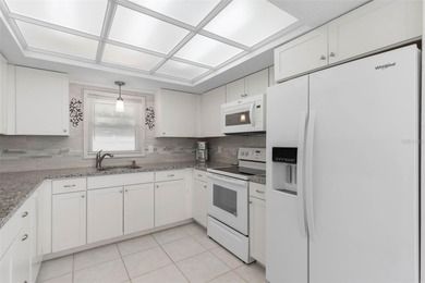 Do you like to play Golf? Are you looking for a place in a quiet on Palm Harbor Golf Club in Florida - for sale on GolfHomes.com, golf home, golf lot