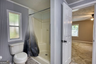 Charming 3-bedroom, 2-bath home in the desirable Turtle Cove on Turtle Cove Golf Course in Georgia - for sale on GolfHomes.com, golf home, golf lot
