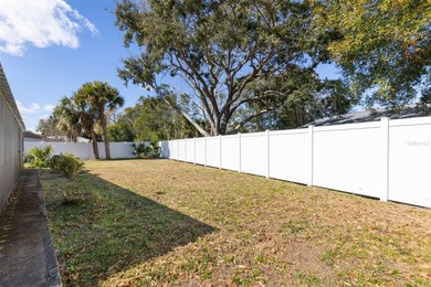 Do you like to play Golf? Are you looking for a place in a quiet on Palm Harbor Golf Club in Florida - for sale on GolfHomes.com, golf home, golf lot