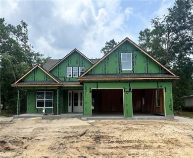 This stunning two-story home by renowned local builder Josselyn on Laurel Island Links in Georgia - for sale on GolfHomes.com, golf home, golf lot