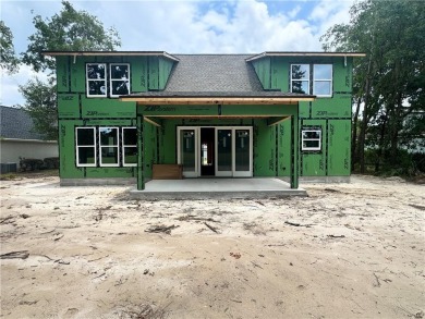 This stunning two-story home by renowned local builder Josselyn on Laurel Island Links in Georgia - for sale on GolfHomes.com, golf home, golf lot