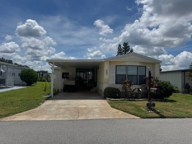 Welcome home to this lovely 2-bedroom, 2-bath oasis in the 55+ on Lake Henry Golf Club in Florida - for sale on GolfHomes.com, golf home, golf lot