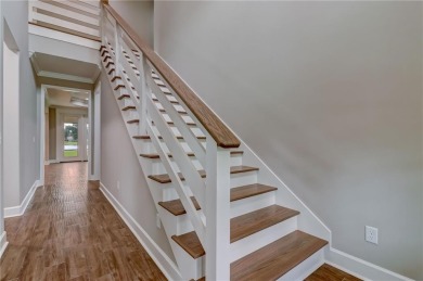 This stunning two-story home by renowned local builder Josselyn on Laurel Island Links in Georgia - for sale on GolfHomes.com, golf home, golf lot
