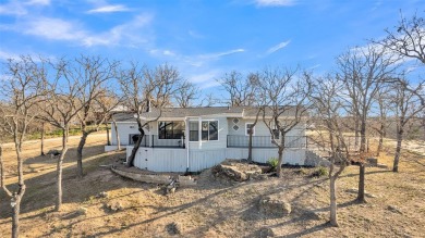 Scenic drive up gives way to a fully remodeled, turnkey home on Nocona Hills Golf Course in Texas - for sale on GolfHomes.com, golf home, golf lot