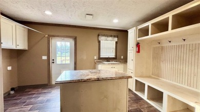 Embrace the charm of lakeside living with this impressive on Links At Lands End in Texas - for sale on GolfHomes.com, golf home, golf lot
