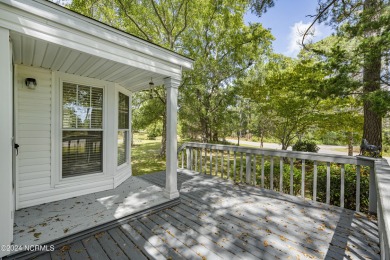 This home is nestled on a picturesque homesite on a quaint on Topsail Green Golf Club in North Carolina - for sale on GolfHomes.com, golf home, golf lot