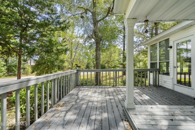 This home is nestled on a picturesque homesite on a quaint on Topsail Green Golf Club in North Carolina - for sale on GolfHomes.com, golf home, golf lot