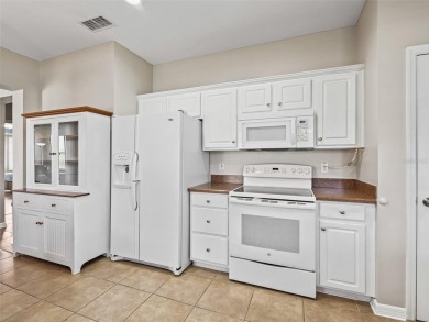 Welcome to your new home in a truly gated community! This on Eagle Ridge At Spruce Creek Country Club in Florida - for sale on GolfHomes.com, golf home, golf lot