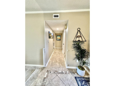 Welcome to 9754 Quail Hollow, situated on the 15th fairway of on Scenic Hills Country Club in Florida - for sale on GolfHomes.com, golf home, golf lot