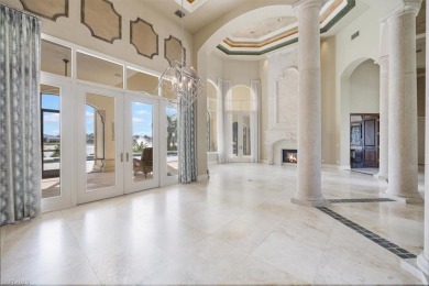 Sitting on a prime golf lake front lot, this custom estate on Quail West Golf and Country Club in Florida - for sale on GolfHomes.com, golf home, golf lot