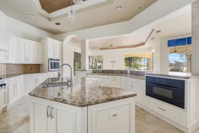 Sitting on a prime golf lake front lot, this custom estate on Quail West Golf and Country Club in Florida - for sale on GolfHomes.com, golf home, golf lot