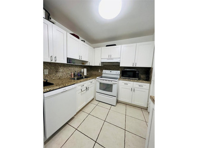 Located in the heart of Emerald Hills, this charming first-floor on The Club at Emerald Hills in Florida - for sale on GolfHomes.com, golf home, golf lot